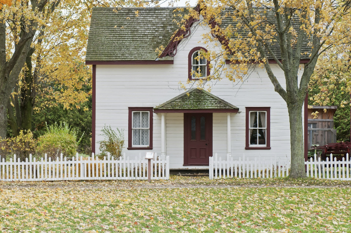 white house under maple trees